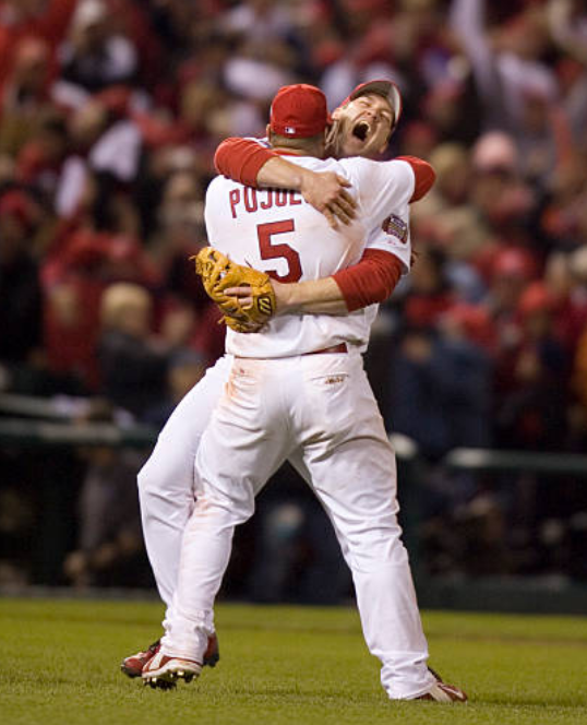 Scott Rolen and Albert Pujols celebrate the final out of the 2006 World Series